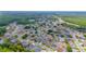 Aerial view of a residential community with ponds and green areas at 7827 Starfire Way, New Port Richey, FL 34654