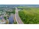 Aerial view of the community featuring a four-lane highway and green spaces at 7827 Starfire Way, New Port Richey, FL 34654