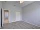 The bedroom features carpet flooring, light-colored walls, and closet at 7827 Starfire Way, New Port Richey, FL 34654