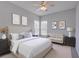 This primary bedroom boasts calming gray walls, carpet flooring, and a cozy seating area at 7827 Starfire Way, New Port Richey, FL 34654