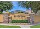 Attractive Rosewood community sign with decorative stone pillars and well-maintained landscaping at 7827 Starfire Way, New Port Richey, FL 34654