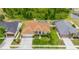 Well-maintained home with lush landscaping, an attached garage, and a screened-in pool at 7827 Starfire Way, New Port Richey, FL 34654