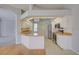 Spacious kitchen featuring an island, stainless steel appliances, and ample cabinet space at 7827 Starfire Way, New Port Richey, FL 34654