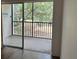 Private balcony with serene views of green space and mature trees at 840 Virginia St # 202, Dunedin, FL 34698