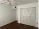 An efficiently designed bedroom features a ceiling fan and convenient closet space at 840 Virginia St # 202, Dunedin, FL 34698