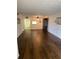 Large living room featuring an open floor plan, wood floors, and lots of light at 840 Virginia St # 202, Dunedin, FL 34698