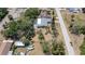 Aerial view showcasing the home's layout, screened pool area, and overall setting at 8522 Inwood Dr, Hudson, FL 34667