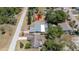 Property aerial view featuring a screened pool, backyard space, and neighborhood context at 8522 Inwood Dr, Hudson, FL 34667