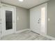 Bright entryway featuring a textured glass door, modern tile flooring, and neutral paint at 8522 Inwood Dr, Hudson, FL 34667