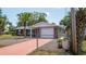 Charming single Gathering home featuring a red brick exterior and well-maintained landscaping at 8522 Inwood Dr, Hudson, FL 34667