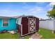 Functional backyard shed with a durable design, providing convenient outdoor storage at 9015 Mark Twain Ln, Port Richey, FL 34668