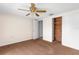 Bedroom with a cedar lined closet and a ceiling fan at 9015 Mark Twain Ln, Port Richey, FL 34668