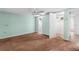 Bedroom featuring a ceiling fan, carpet flooring, closet and an ensuite bathroom at 9015 Mark Twain Ln, Port Richey, FL 34668