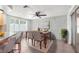 Bright dining area featuring a modern table set, stylish chairs, and contemporary decor at 9015 Mark Twain Ln, Port Richey, FL 34668