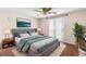 Comfortable bedroom with a plush bed, soft rug, and tranquil decor creating a relaxing ambiance at 9015 Mark Twain Ln, Port Richey, FL 34668