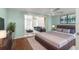 Open bedroom connected to sitting area, featuring cozy furniture and serene decor at 9015 Mark Twain Ln, Port Richey, FL 34668