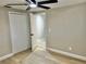 Bedroom with ensuite bathroom and closet with bi-fold doors at 9034 Cochise Ln, Port Richey, FL 34668