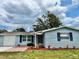 Charming single-story home with a well-manicured front lawn and a classic exterior design at 9034 Cochise Ln, Port Richey, FL 34668