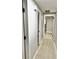 Hallway featuring wood floors and neutral paint at 9034 Cochise Ln, Port Richey, FL 34668