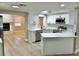 Bright kitchen featuring white cabinets, marble countertops, and stainless steel appliances at 9034 Cochise Ln, Port Richey, FL 34668