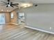 Spacious living room with vaulted ceilings, recessed lighting, and modern flooring at 9034 Cochise Ln, Port Richey, FL 34668