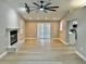 Open concept living area with fireplace, new flooring and recessed lighting at 9034 Cochise Ln, Port Richey, FL 34668