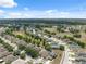 Expansive aerial view of a residential community showcasing the neighborhood's layout and surroundings at 9048 Southern Charm Cir, Brooksville, FL 34613