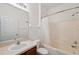 Bathroom with single sink vanity, shower-tub combo, and white shower curtain at 9048 Southern Charm Cir, Brooksville, FL 34613