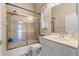 Bathroom with tub and shower combo and bright white vanity at 9245 Grand Cypress Dr, Spring Hill, FL 34613