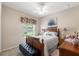 Cozy bedroom with a wooden bed frame and bright natural light at 9245 Grand Cypress Dr, Spring Hill, FL 34613