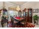 Formal dining room with a decorative chandelier and china cabinet at 9245 Grand Cypress Dr, Spring Hill, FL 34613