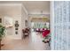 Home entryway leads to the spacious living room with plush seating and views of the pool at 9245 Grand Cypress Dr, Spring Hill, FL 34613