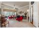 Spacious living room with bright natural light, tile flooring, and elegant furnishings at 9245 Grand Cypress Dr, Spring Hill, FL 34613