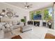 Inviting living room features tile floors, large windows, and a cozy fireplace at 9245 Grand Cypress Dr, Spring Hill, FL 34613