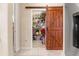 A large pantry featuring a custom sliding barn door offers ample storage space with organized shelving at 9245 Grand Cypress Dr, Spring Hill, FL 34613