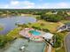 Community aerial of pools, tennis courts, golf course and neighborhood landscape at 10187 Holly Berry Dr, Weeki Wachee, FL 34613