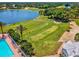 Beautiful aerial of the golf course near a lake at 10187 Holly Berry Dr, Weeki Wachee, FL 34613