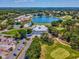 Beautiful aerial of the neighborhood, golf course, lake, and tennis court at 10187 Holly Berry Dr, Weeki Wachee, FL 34613