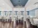 Elegant dining room with high ceilings, chandelier, wood floors, and ample natural light at 10187 Holly Berry Dr, Weeki Wachee, FL 34613