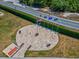 Overhead shot of a circular plaza paved with pavers and surrounded by flags of the United States of America at 10187 Holly Berry Dr, Weeki Wachee, FL 34613