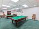 Game room with pool tables and comfortable seating at 10187 Holly Berry Dr, Weeki Wachee, FL 34613