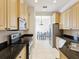 Bright kitchen featuring stainless steel appliances, granite countertops, and wood cabinets at 10187 Holly Berry Dr, Weeki Wachee, FL 34613