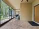 Covered outdoor patio featuring brick flooring, an outdoor seating area, and peaceful backyard views at 10187 Holly Berry Dr, Weeki Wachee, FL 34613