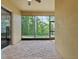 Enjoy the natural views from this spacious screened-in outdoor patio at 10187 Holly Berry Dr, Weeki Wachee, FL 34613