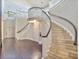 Elegant curved staircase with stone steps and wood railings at 10187 Holly Berry Dr, Weeki Wachee, FL 34613