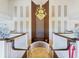 Ornate staircase with chandelier and detailed wall accents at 10187 Holly Berry Dr, Weeki Wachee, FL 34613