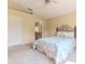 Primary bedroom with carpet, double closet and access to ensuite bathroom at 1032 Walnut Hill Ct, Spring Hill, FL 34609