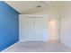 Bright bedroom features neutral carpet, a large closet and white trim at 1032 Walnut Hill Ct, Spring Hill, FL 34609