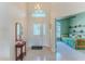Inviting foyer with tile flooring, high ceilings, and a view into the living area at 1032 Walnut Hill Ct, Spring Hill, FL 34609