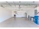 Clean, organized garage with shelving, a door to the outside, water heater, and plenty of storage space at 1032 Walnut Hill Ct, Spring Hill, FL 34609